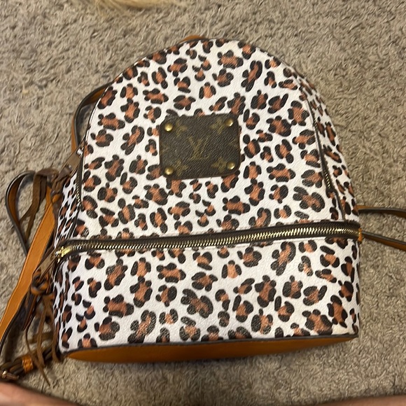 louis vuitton cheetah backpack Leopard Coffin secure top and side openings Louis Vuitton Palm Springs PM